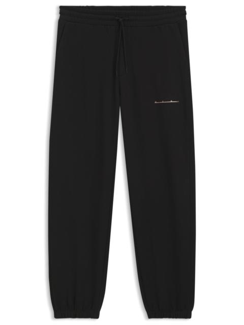 HUGO RELAXED-FIT COTTON PANTS WITH STREETWEAR LOGO