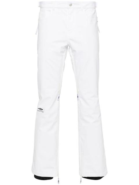 BALENCIAGA logo-print press-stud flared trousers