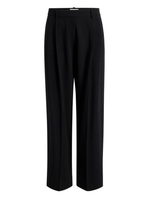 KHAITE belt-loops pleated trousers