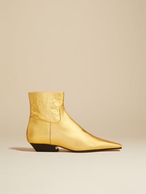 KHAITE The Marfa Ankle Boot in Gold Metallic Leather