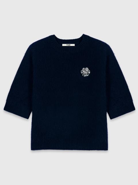 maje Sweater with floral brooch
