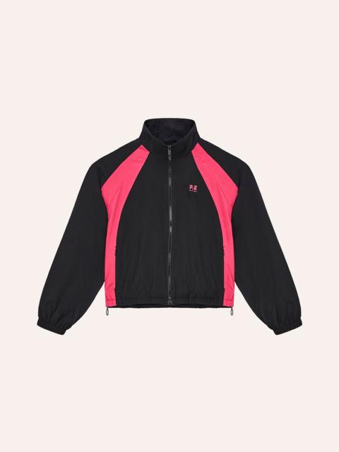P.E NATION STRIDE JACKET IN BLACK & COSMO PINK