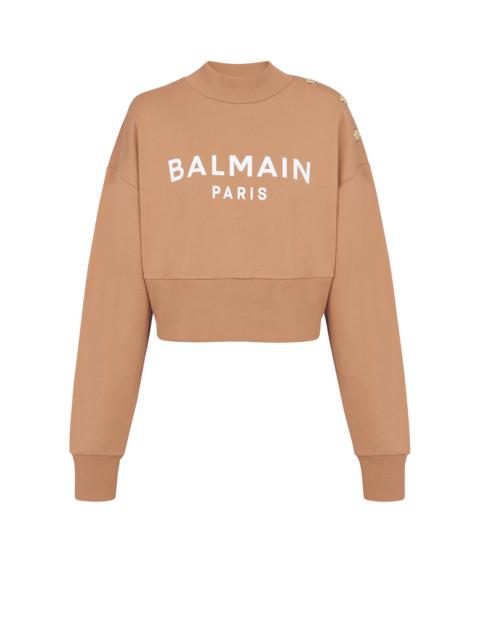 Balmain Cropped buttoned Balmain logo print sweatshirt