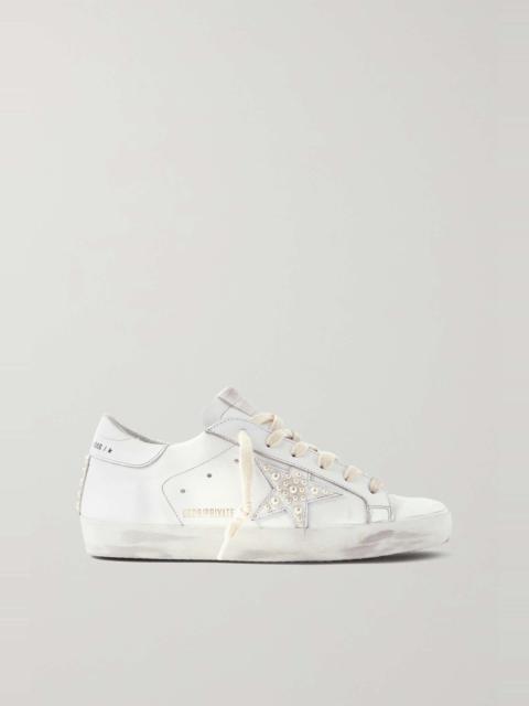 Superstar crystal-embellished distressed leather and suede sneakers