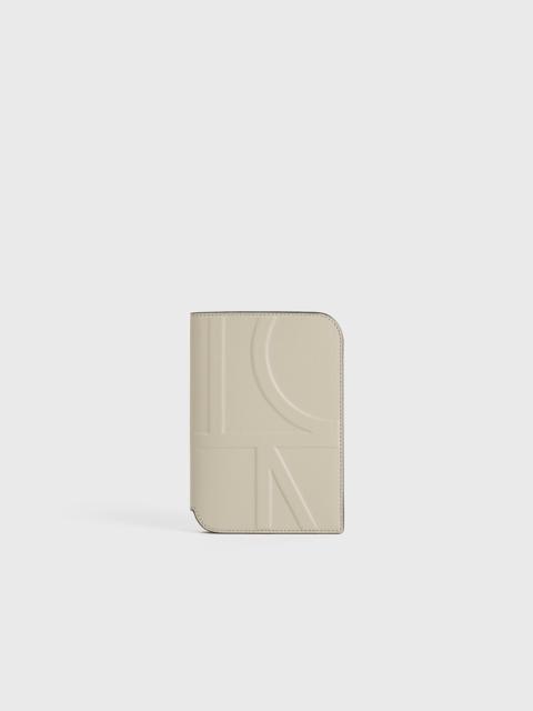 Totême Monogram leather passport holder fawn