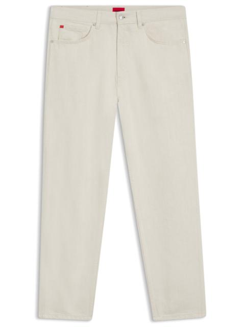 HUGO TAPERED-FIT JEANS IN ECRU DENIM