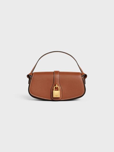 CLUTCH ON STRAP TABOU in Smooth calfskin