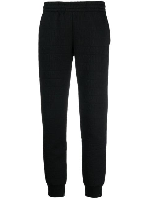 Moschino flocked-logo elasticated-waist 트랙 바지