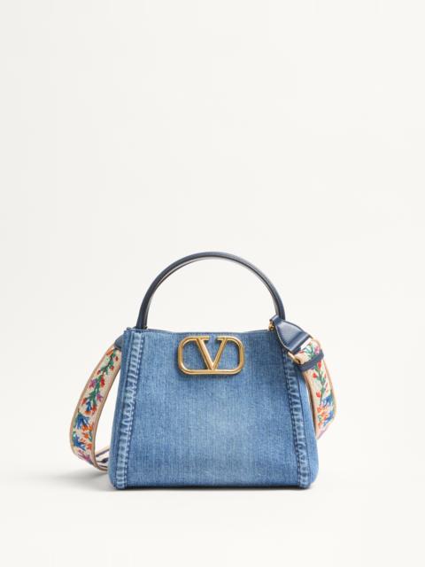 Valentino VALENTINO GARAVANI ALLTIME MEDIUM HANDBAG IN DENIM WITH EMBROIDERED STRAP