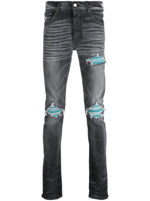 AMIRI distressed skinny jeans