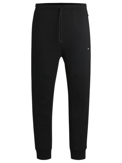 BOSS STRETCH TRACKSUIT BOTTOMS WITH LOGO PATCH