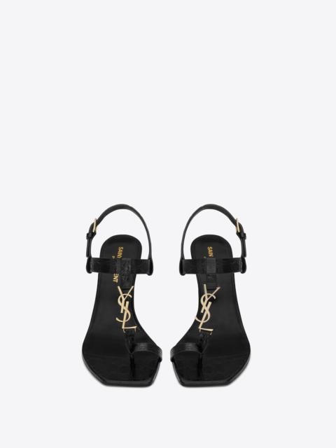 SAINT LAURENT cassandra heeled sandals in crocodile-embossed leather with gold-tone monogram