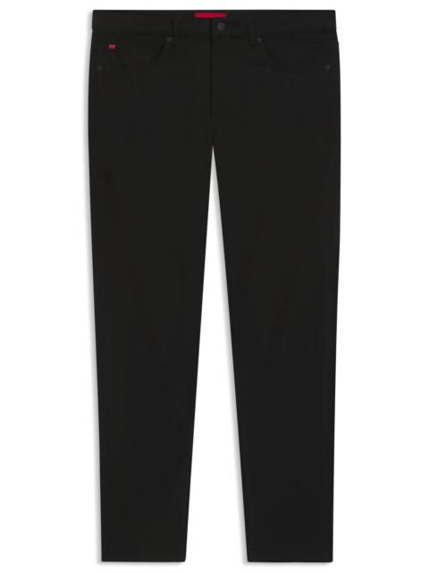 HUGO EXTRA-SLIM-FIT JEANS IN BLACK SATIN-TOUCH DENIM