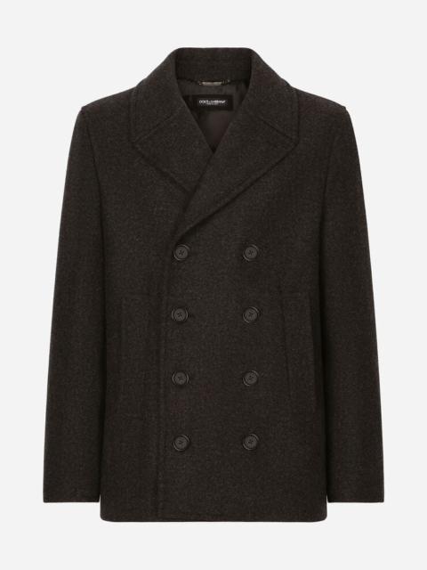 Double-breasted wool pea coat with branded tag