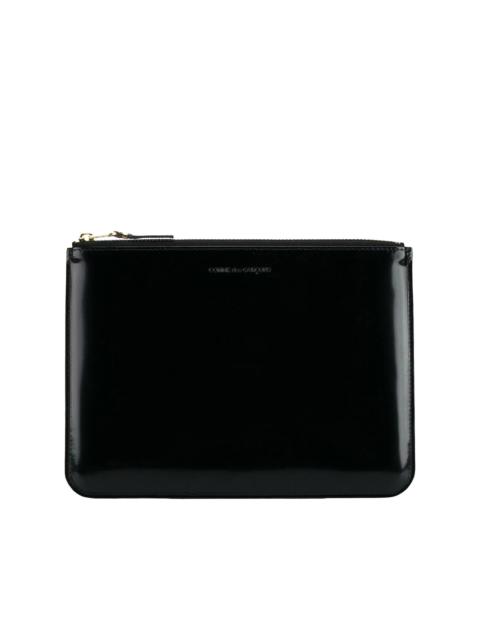 logo-debossed leather clutch bag