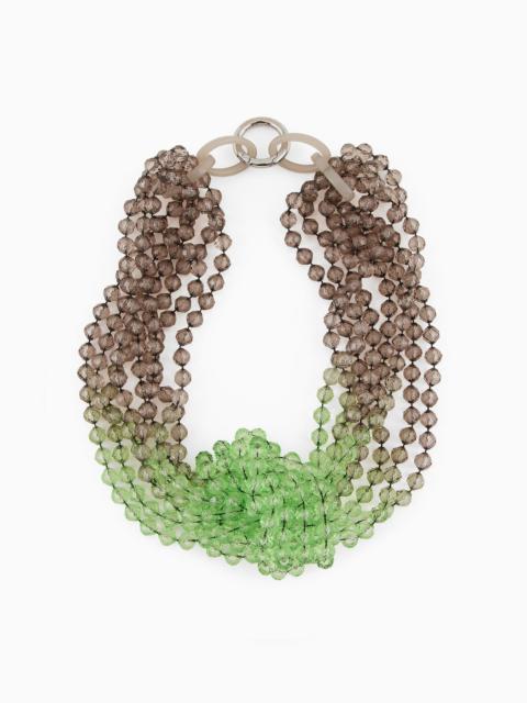 Gradient multistrand necklace with knot