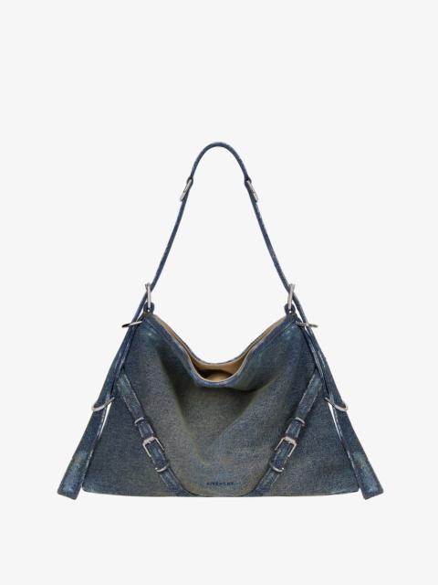 MEDIUM VOYOU BAG IN WASHED DENIM