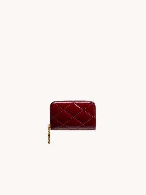 SAINT LAURENT CASSANDRE BIJOU CHANGE PURSE IN PATENT LEATHER