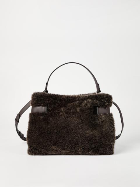 Brunello Cucinelli Essence top-handle bag in merino shearling with shiny bands