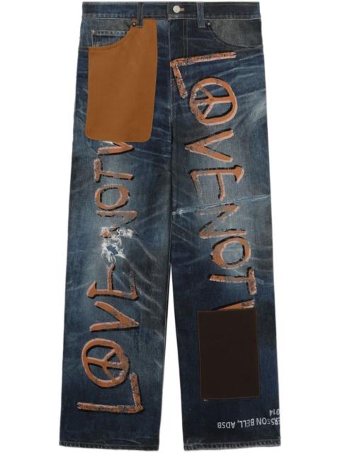 Andersson Bell text-print jeans