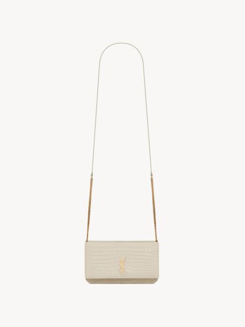 SAINT LAURENT CASSANDRE PHONE HOLDER IN SHINY CROCODILE-EMBOSSED LEATHER