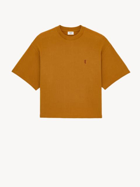SAINT LAURENT CASSANDRE OVERSIZED T-SHIRT IN COTTON PIQUÉ