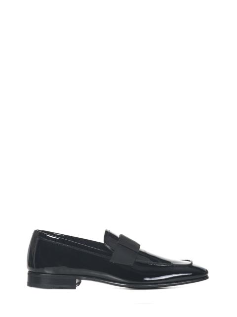 TOM FORD Edgar loafers in black patent leather with grosgrain detail on the front.