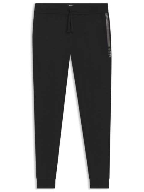 BOSS LOGO-PRINT TRACKSUIT BOTTOMS IN COTTON TERRY