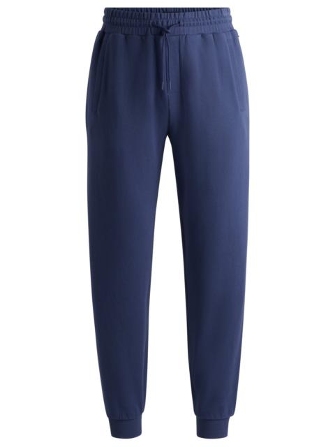 BOSS COTTON-TERRY TRACKSUIT BOTTOMS WITH FLOCKED LOGO