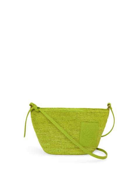 Slit Pochette bag in raffia and calfskin