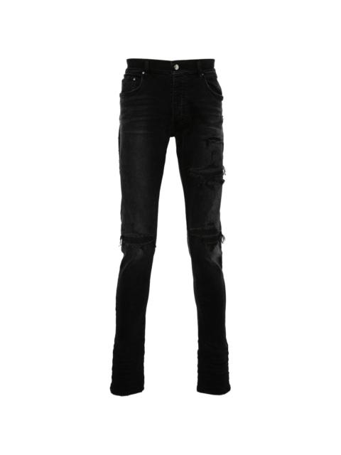 AMIRI logo-patch cotton jeans