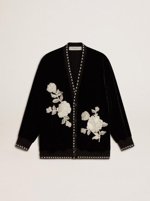 Black velvet jacket with floral embroidery on the front