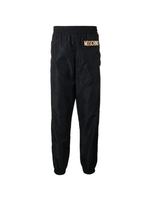 Moschino LOGO JOGGING PANTS WITH RIBBED TRIMS | miinto
