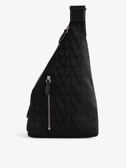 VLOGO monogram-pattern woven sling bag