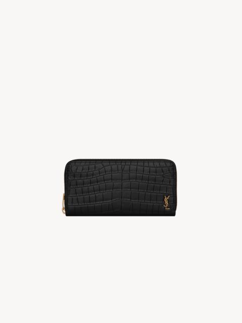 SAINT LAURENT TINY CASSANDRE ZIP-AROUND WALLET IN CROCODILE-EMBOSSED MATTE LEATHER