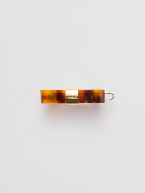 Prada Plex and metal hair clip
