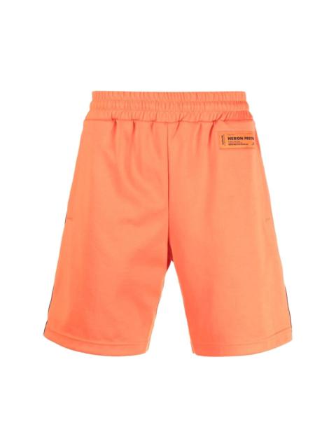 Heron Preston logo tape track shorts