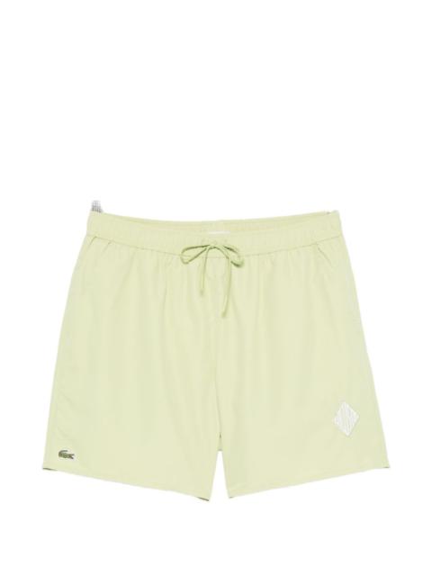 LACOSTE drawstring geometric swim shorts