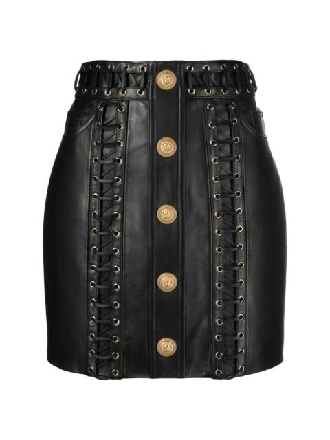 eyelet-embellished buttoned leather miniskirt