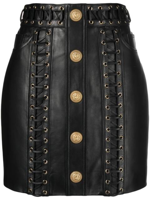 eyelet-embellished buttoned leather miniskirt