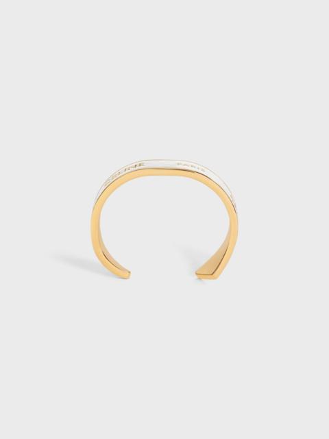 CELINE CELINE RIBBON SMALL CUFF IN BRASS WITH GOLD FINISH AND ENAMEL