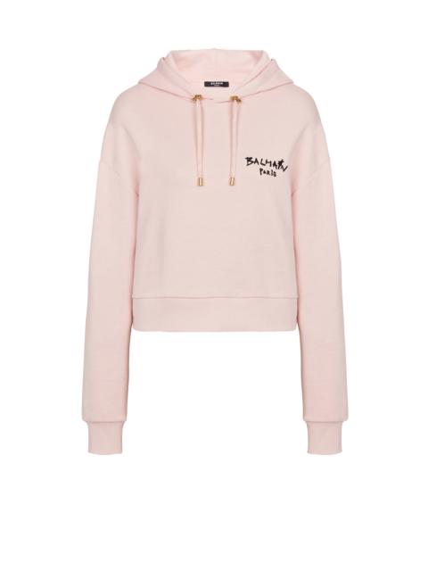 Balmain Cropped eco-design cotton sweatshirt with flocked graffiti Balmain logo