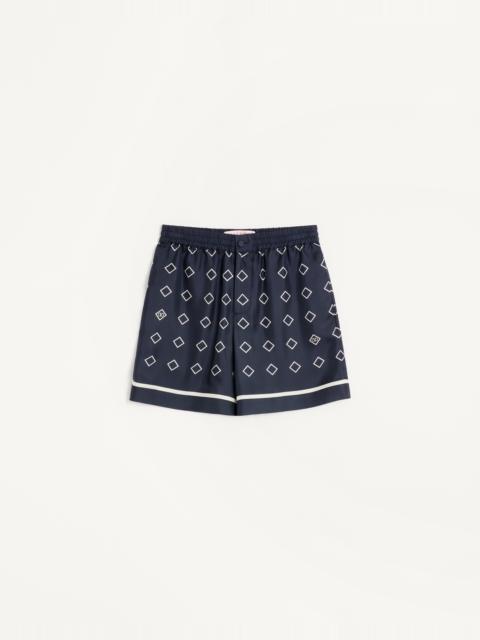 Valentino SILK TWILL BERMUDA SHORTS WITH ALL-OVER OPTICOOL PRINT
