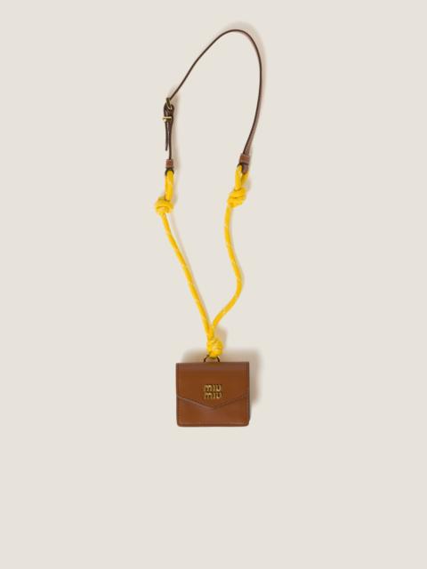 Miu Miu Leather, cord, and metal trick with mini-pouch