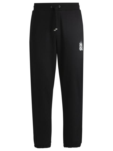 HUGO COTTON-TERRY TRACKSUIT BOTTOMS WITH SMOKE LOGO