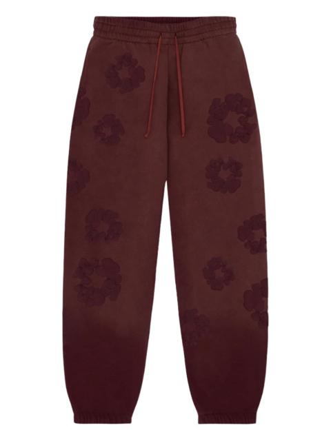DENIM TEARS flower-embellishment track pants