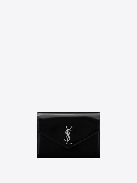 SAINT LAURENT cassandre flap pouch in shiny leather