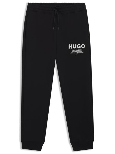 HUGO COTTON-TERRY TRACKSUIT BOTTOMS WITH LOGO PRINT