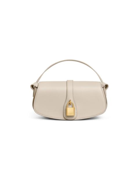 Clutch on strap tabou in smooth calfskin