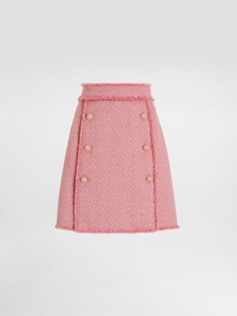 Dolce & Gabbana Short raschel tweed skirt with decorative DG logo buttons